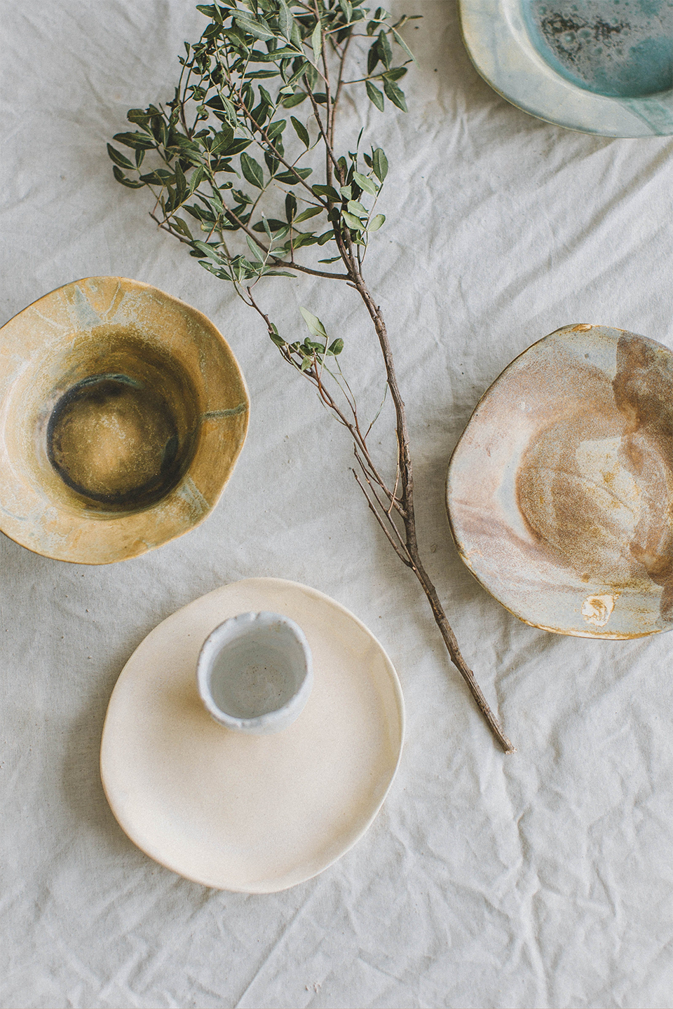 Brand Photography flat lay handmade bowls on linen table cloth with twig